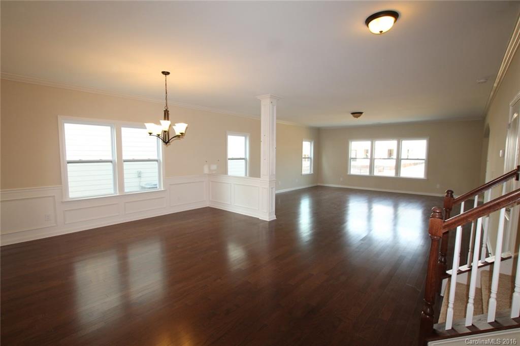 2032 Fuschia Court, Unit 136 Fort Mill, SC 29708 - Photo 3 of 22 a view of empty room with wooden floor and window