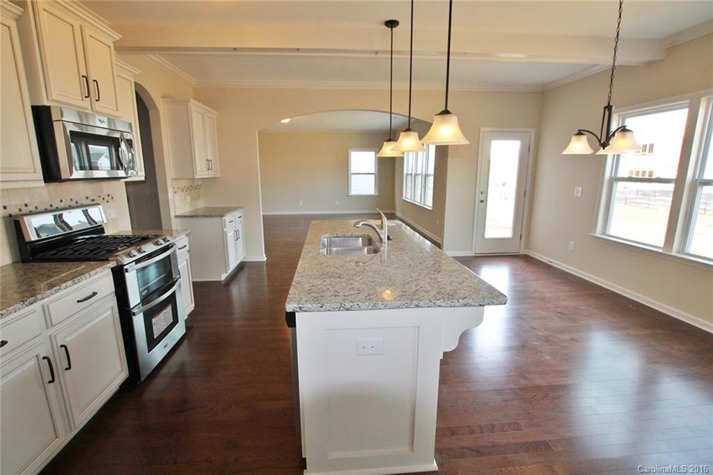 2032 Fuschia Court, Unit 136 Fort Mill, SC 29708 - Photo 7 of 22 a kitchen with sink stove and refrigerator