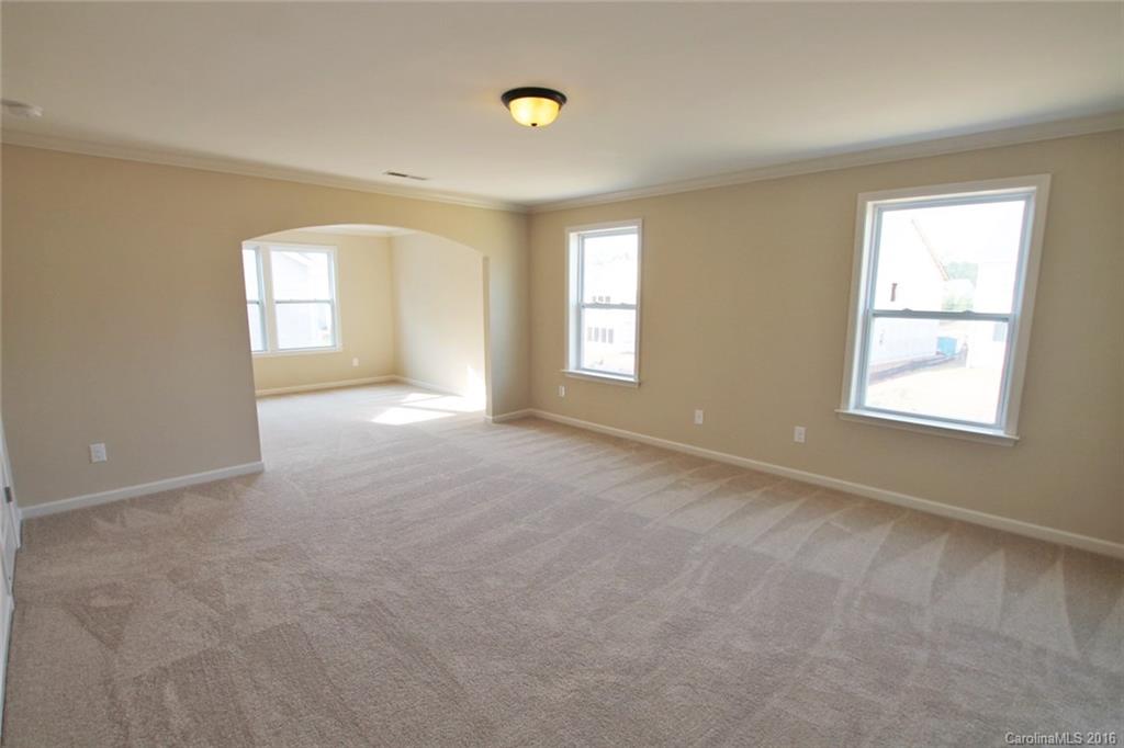 2032 Fuschia Court, Unit 136 Fort Mill, SC 29708 - Photo 9 of 22 an empty room with windows and closet