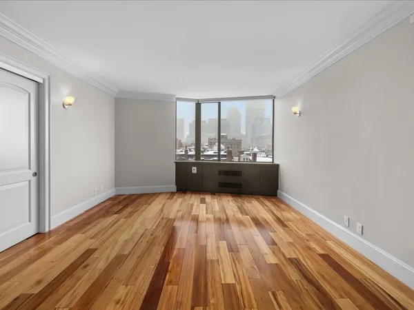 a room with a bed and a window