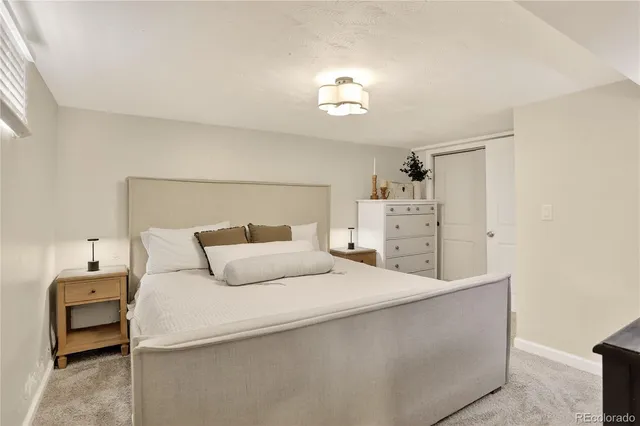 a bedroom with a bed and a cabinets