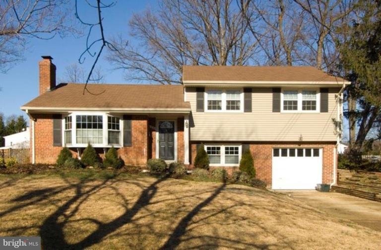 6804 Front Royal Road Springfield, VA 22151 - Photo 1 of 27 a front view of a house with a yard