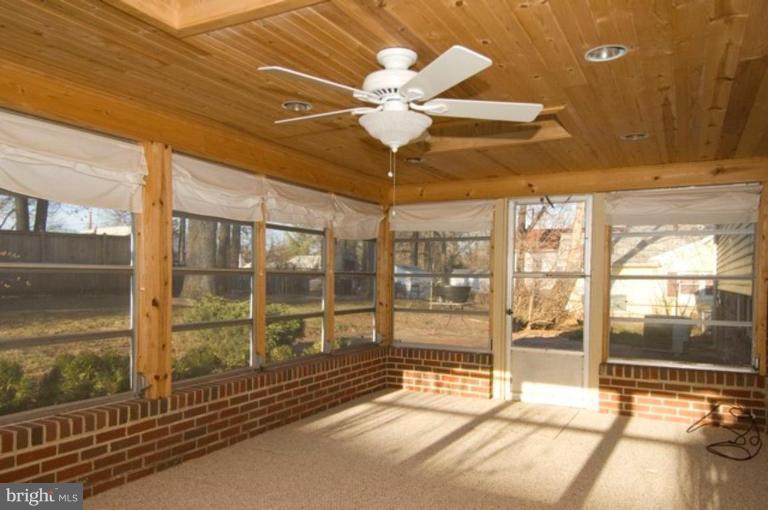 6804 Front Royal Road Springfield, VA 22151 - Photo 13 of 27 a view of a room with a ceiling fan and window