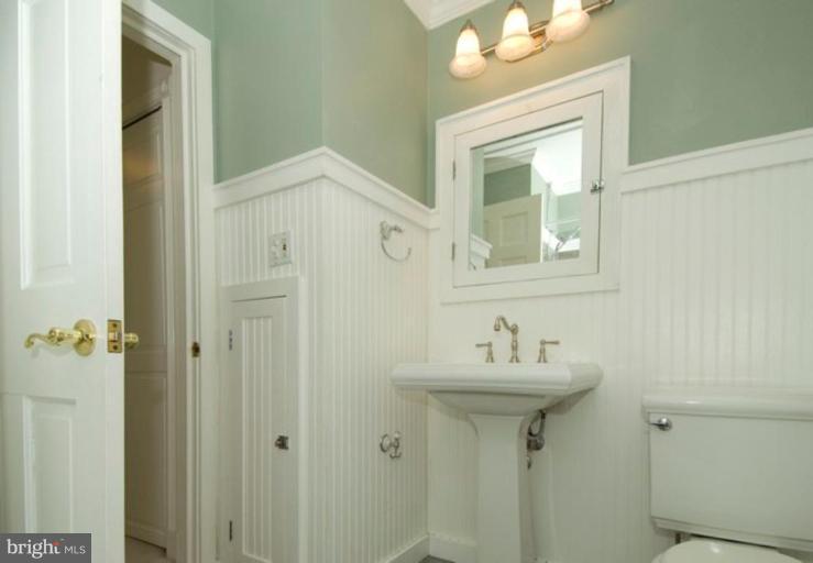 6804 Front Royal Road Springfield, VA 22151 - Photo 19 of 27 a bathroom with a sink mirror and a window