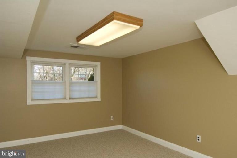 6804 Front Royal Road Springfield, VA 22151 - Photo 21 of 27 an empty room with a window