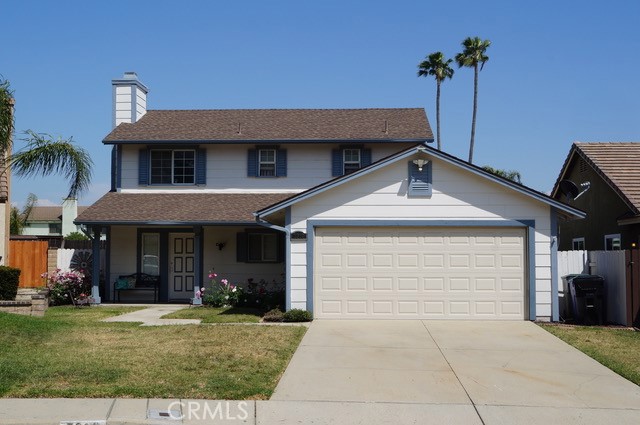 7309 Ambrosia Road Rancho Cucamonga, CA 91730 - Photo 1 of 1 a front view of a house with garden