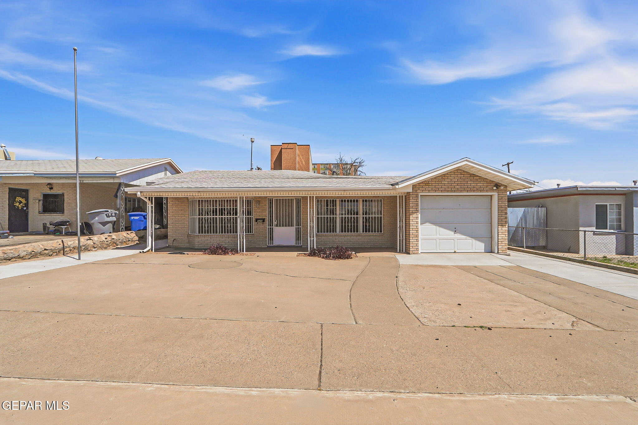 520 Cardon Street El Paso, TX 79903 - Photo 1 of 42 a front view of a house with a yard