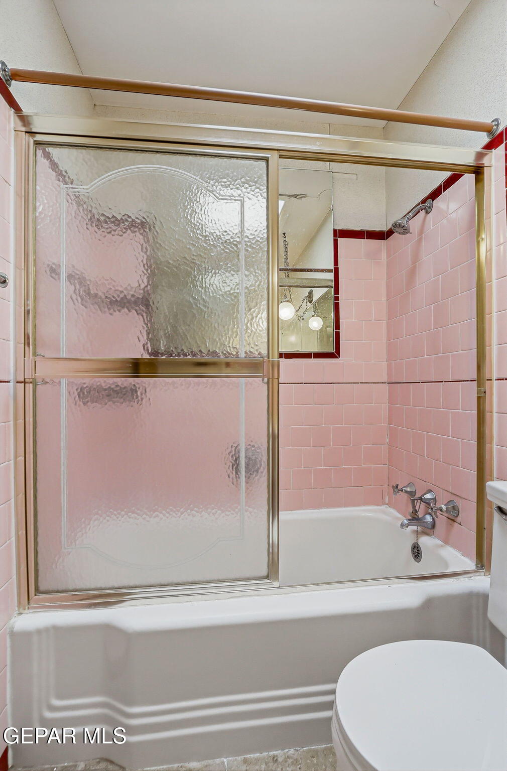 520 Cardon Street El Paso, TX 79903 - Photo 12 of 42 a bathroom with a shower and a toilet