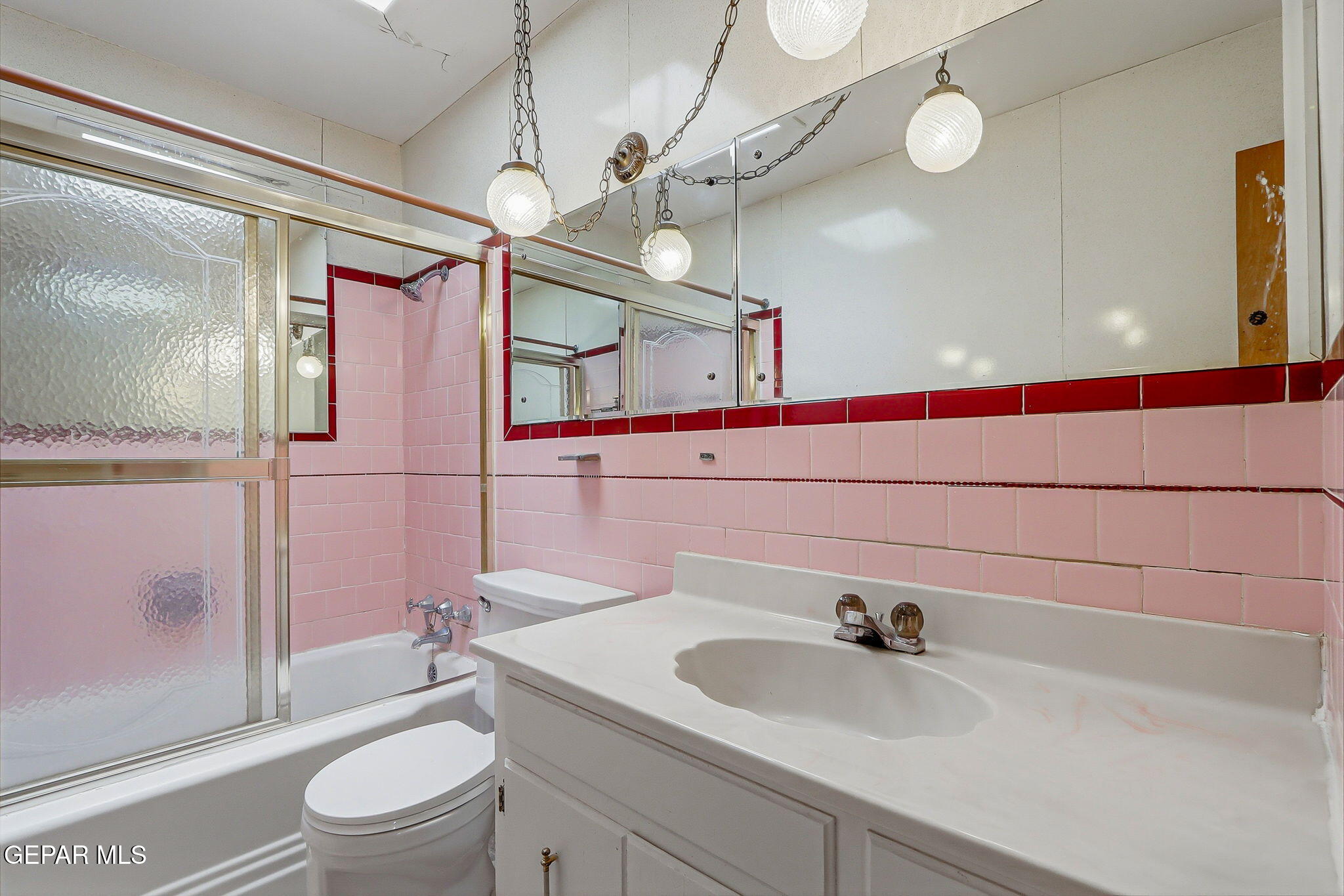 520 Cardon Street El Paso, TX 79903 - Photo 13 of 42 a bathroom with a sink a toilet and shower