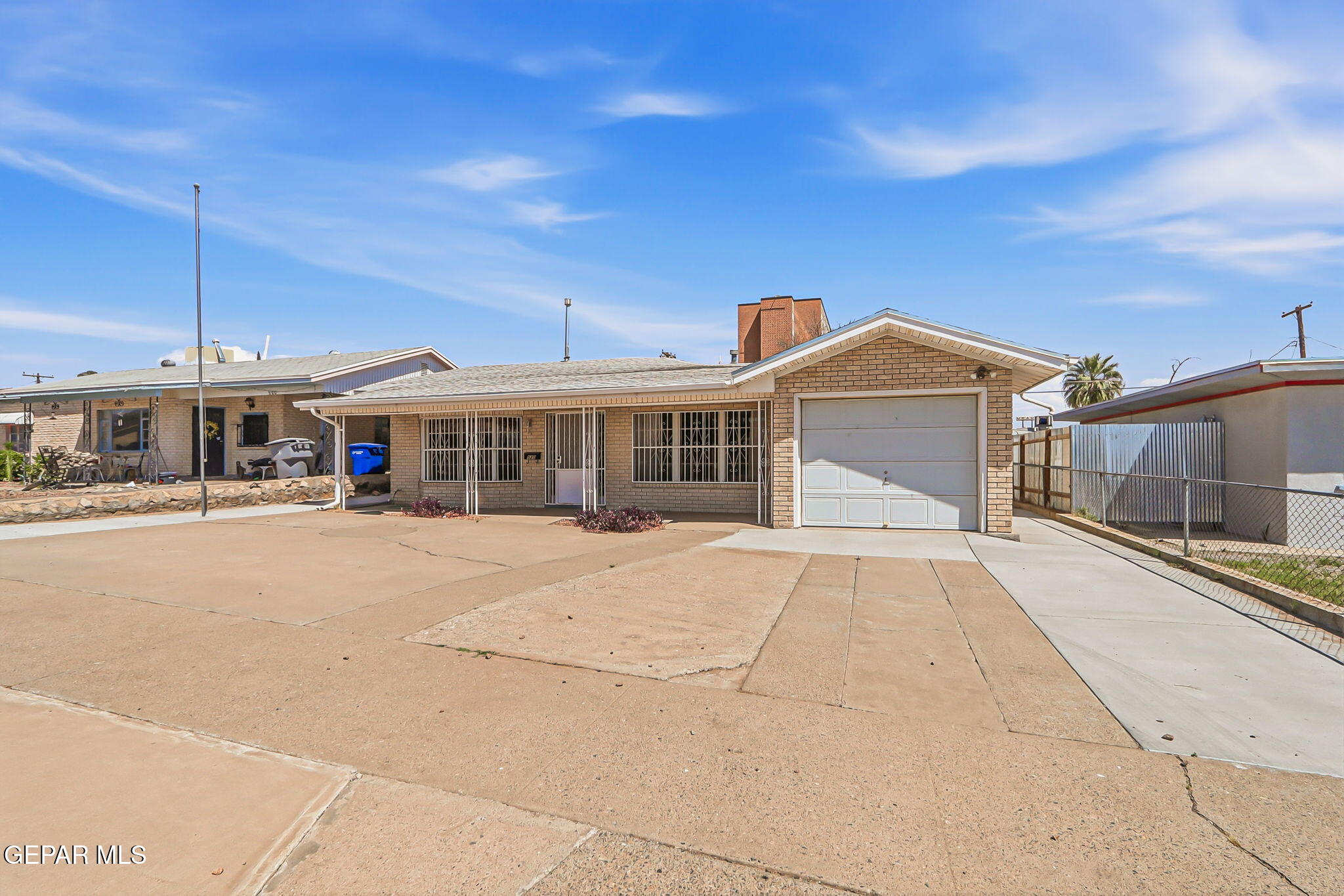 520 Cardon Street El Paso, TX 79903 - Photo 2 of 42 a front view of a house with a yard