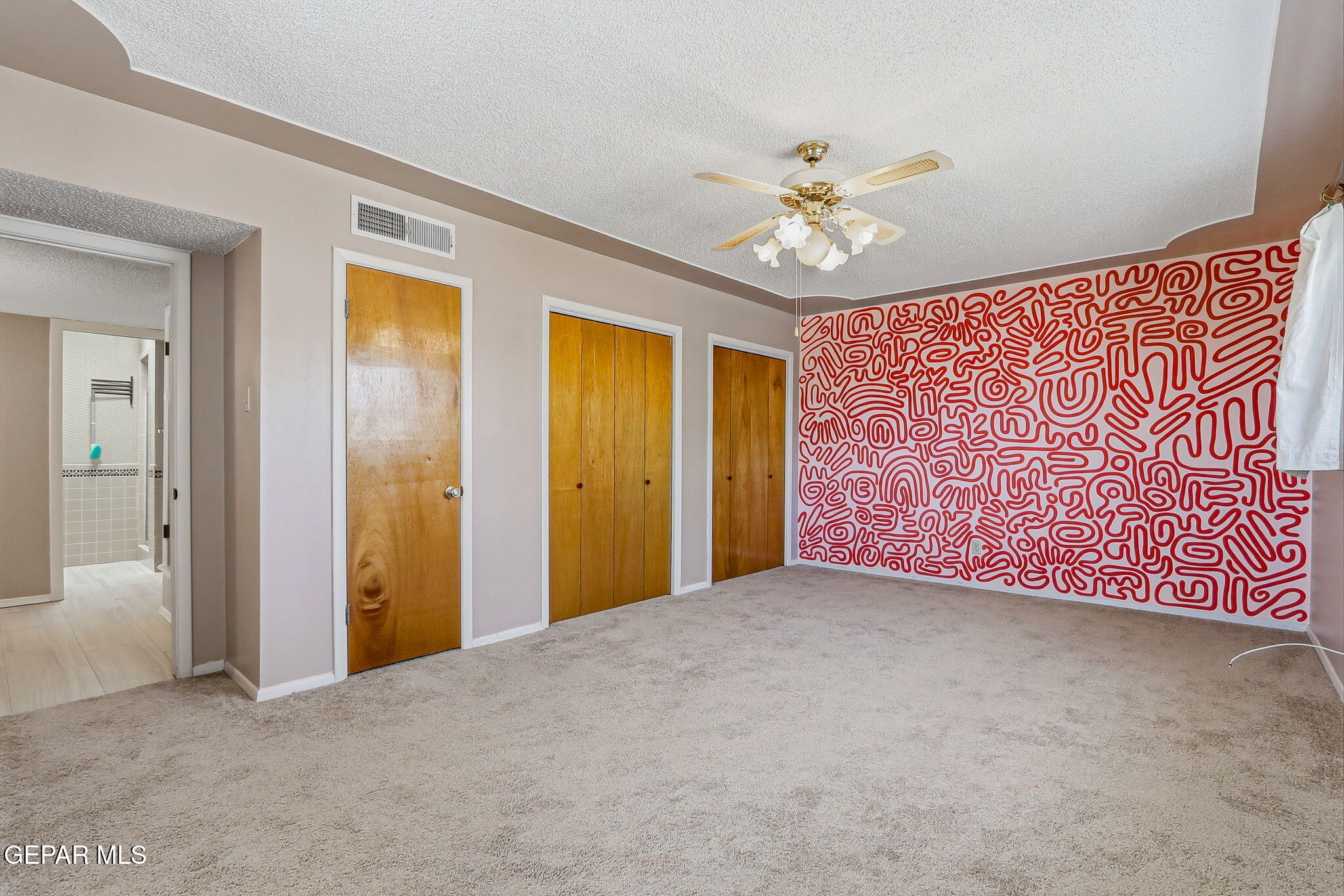 520 Cardon Street El Paso, TX 79903 - Photo 22 of 42 an empty room with windows and fan