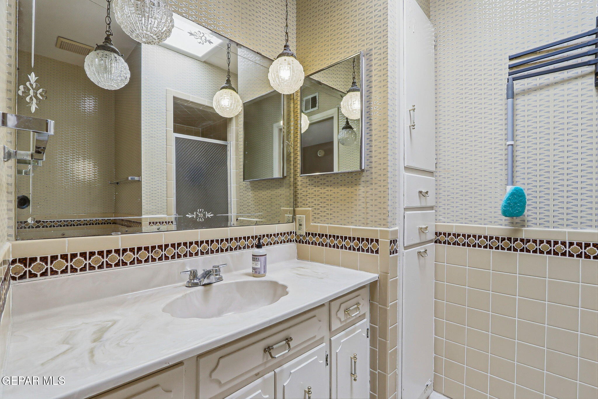 520 Cardon Street El Paso, TX 79903 - Photo 25 of 42 a bathroom with a sink and a mirror