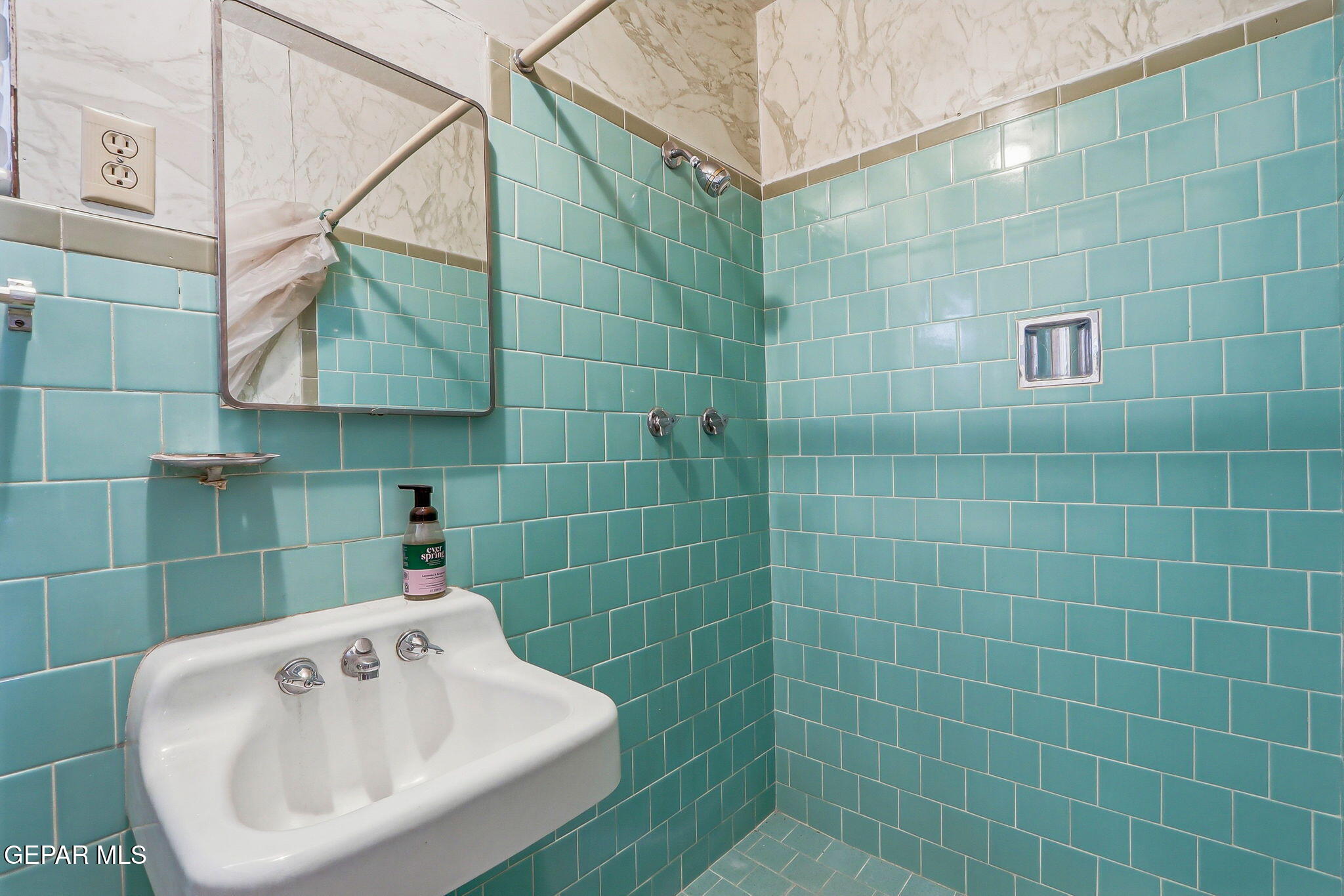 520 Cardon Street El Paso, TX 79903 - Photo 29 of 42 a bathroom with a sink and a shower