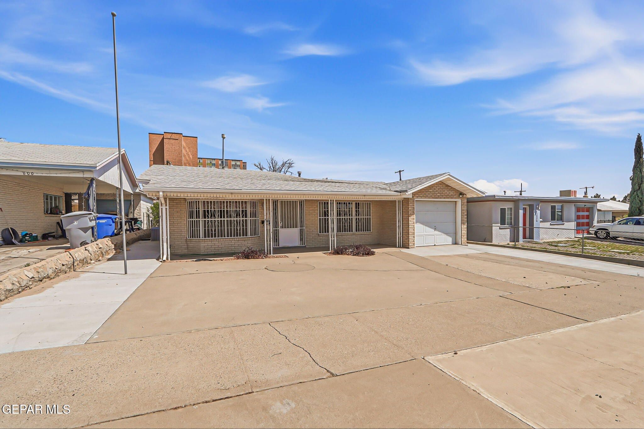 520 Cardon Street El Paso, TX 79903 - Photo 3 of 42 a front view of a house with a yard