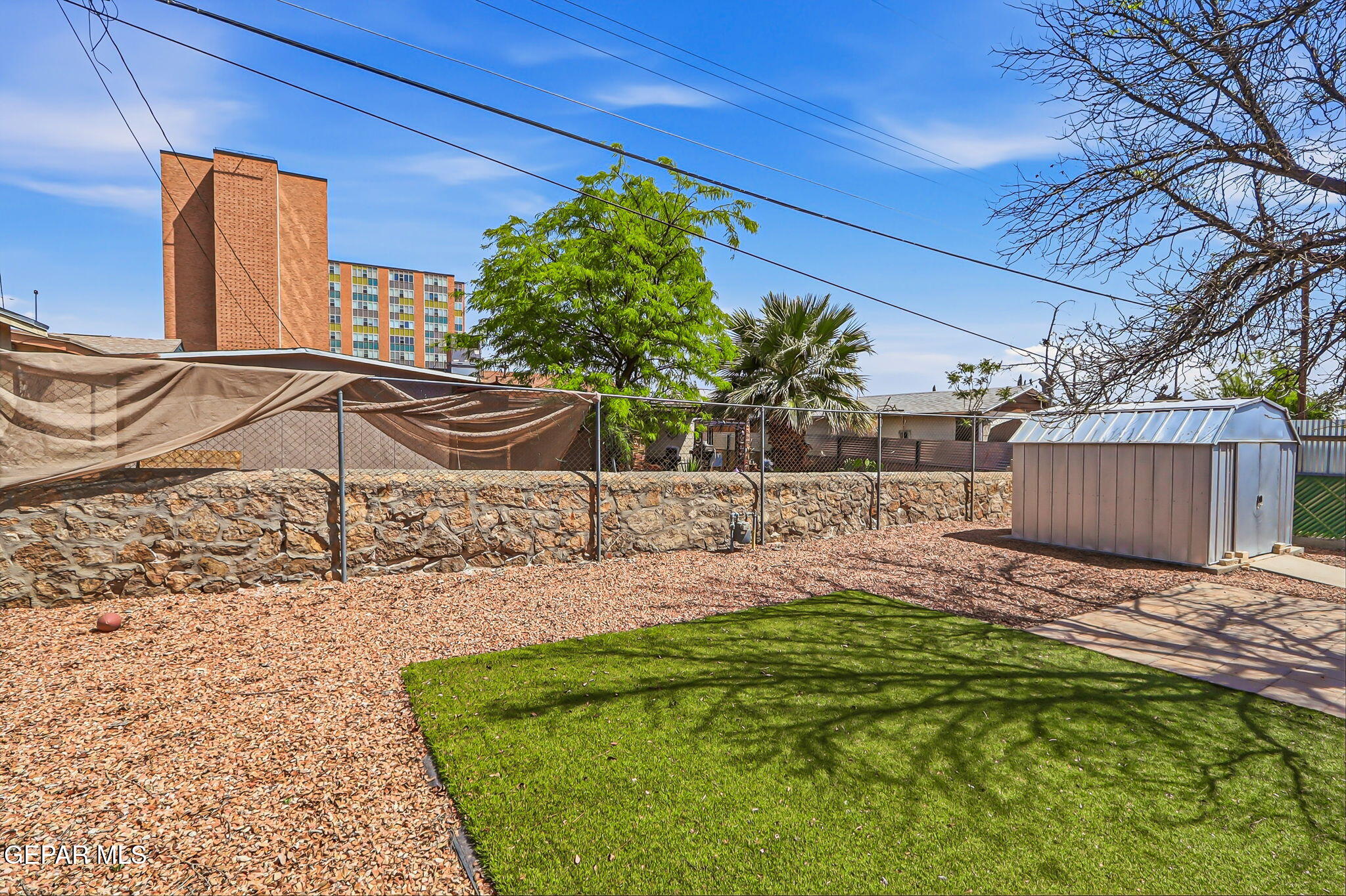 520 Cardon Street El Paso, TX 79903 - Photo 31 of 42 a backyard of a house with table and chairs