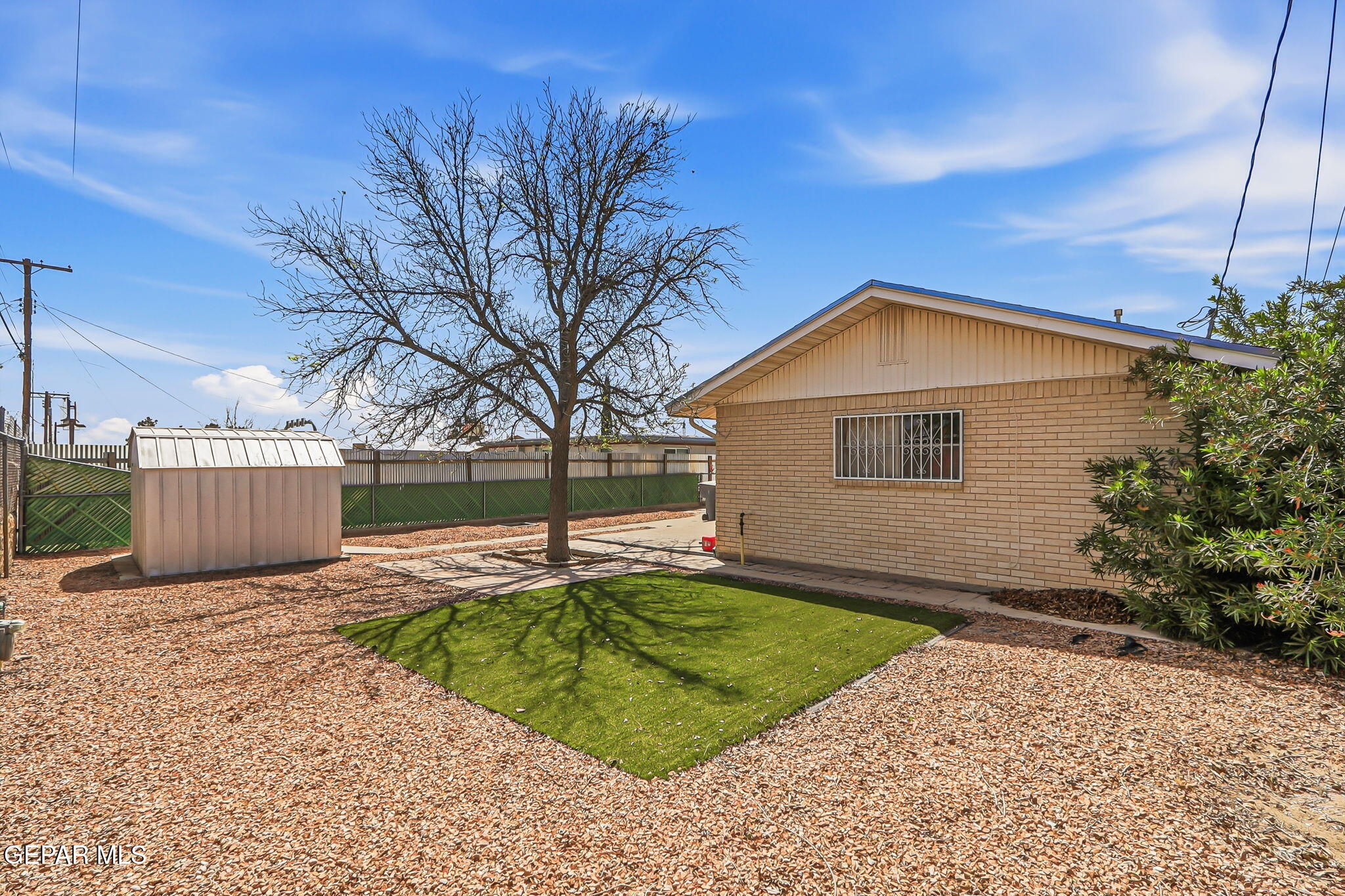 520 Cardon Street El Paso, TX 79903 - Photo 32 of 42 a front view of a house with a yard and garage