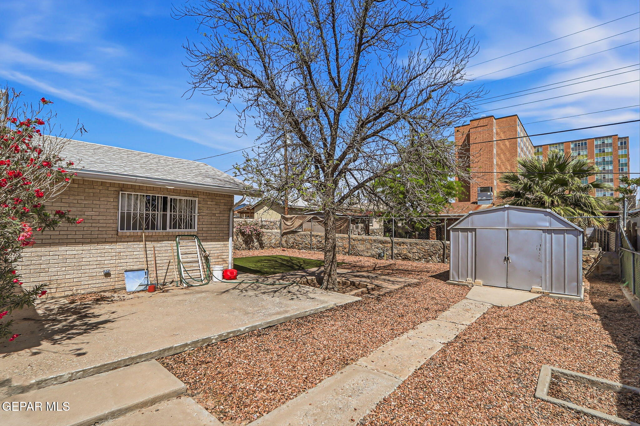 520 Cardon Street El Paso, TX 79903 - Photo 34 of 42 a view of a house with a yard covered in snow