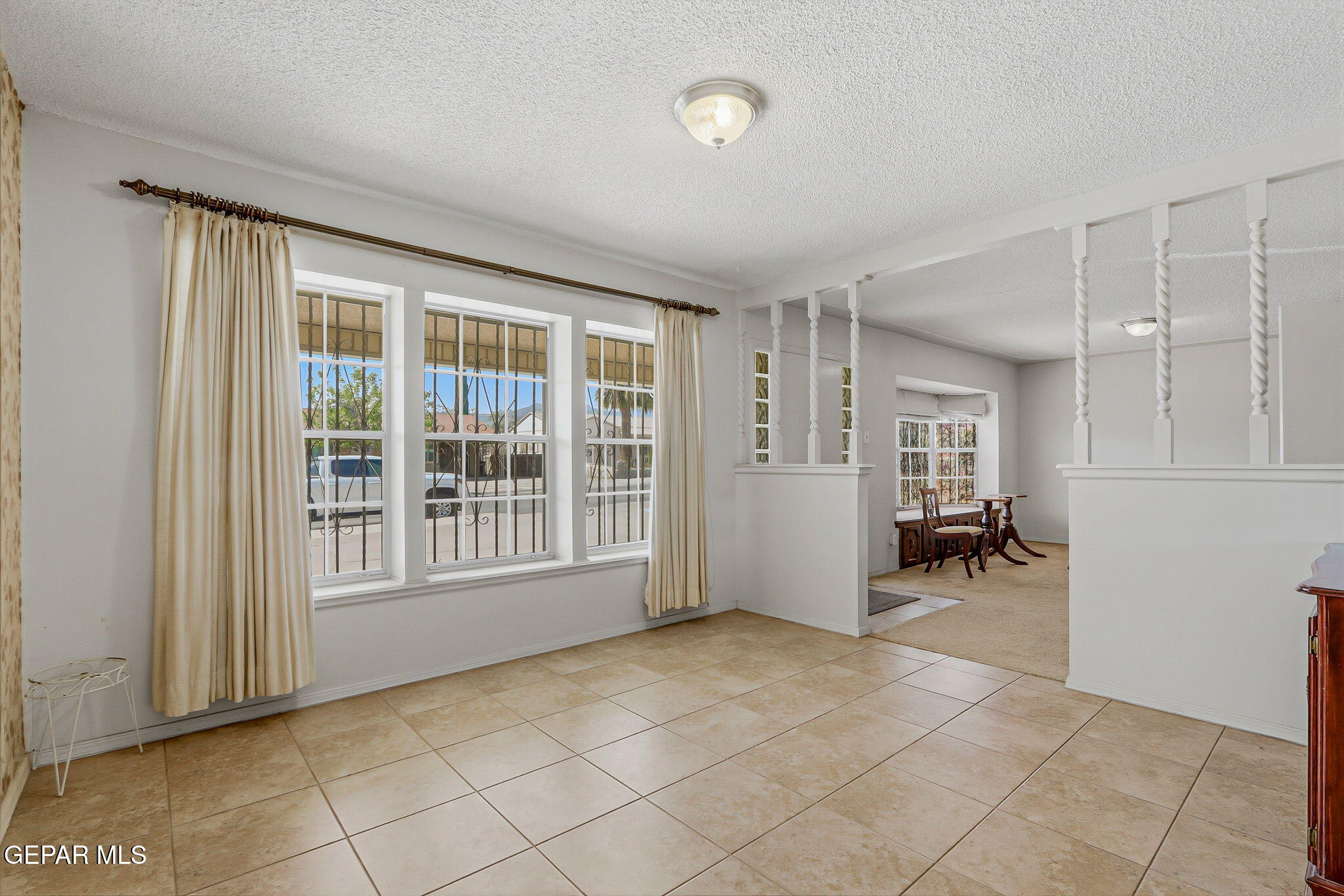 520 Cardon Street El Paso, TX 79903 - Photo 5 of 42 an empty room with furniture and windows