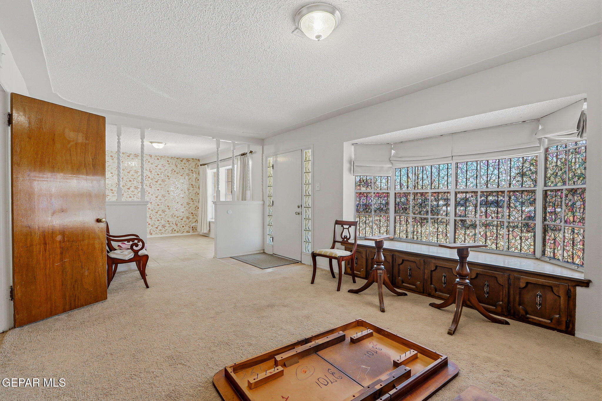 520 Cardon Street El Paso, TX 79903 - Photo 8 of 42 a living room with furniture a flat screen tv and a window