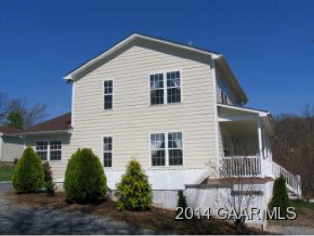 1018 Mt Solon Road Mount Solon, VA 22843 - Photo 3 of 22 a front view of a house with garage