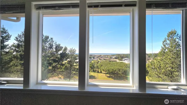 a view of a room that has a large window