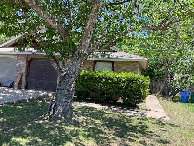 16127 Stoneham Circle Pflugerville, TX 78660 - Photo 1 of 1 a view of a garden with a tree