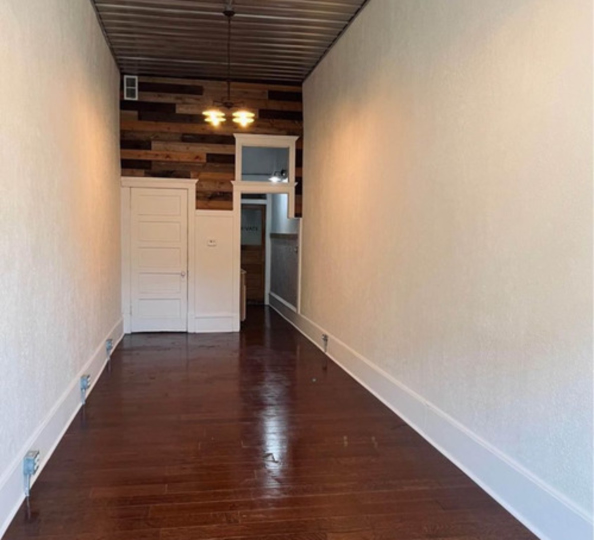 112 North Monroe Street Streator, IL 61364 - Photo 4 of 8 a view of empty room with wooden floor