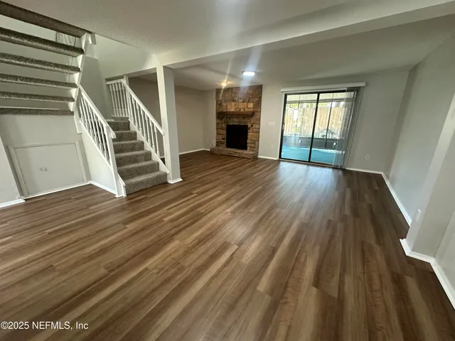 a view of entryway with wooden floor