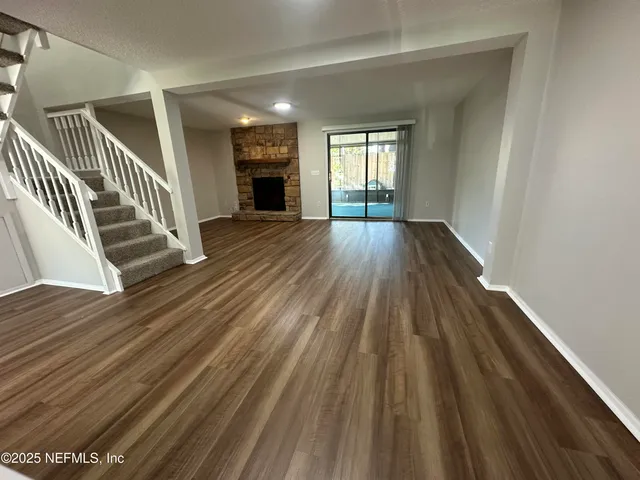 a view of entryway with wooden floor