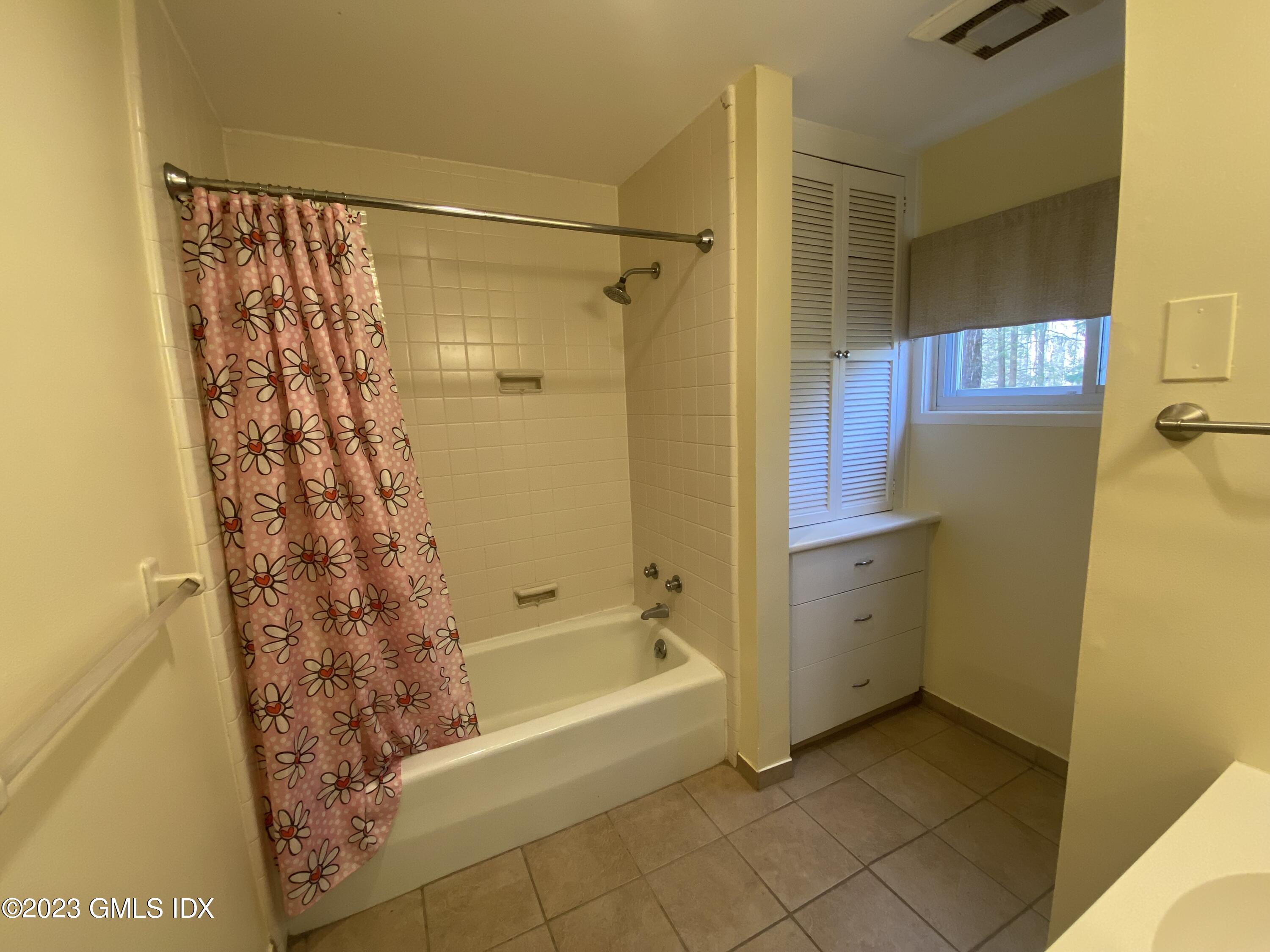 21 Hycliff Road Greenwich, CT 06831 - Photo 11 of 13 a bathroom with a bathtub and shower