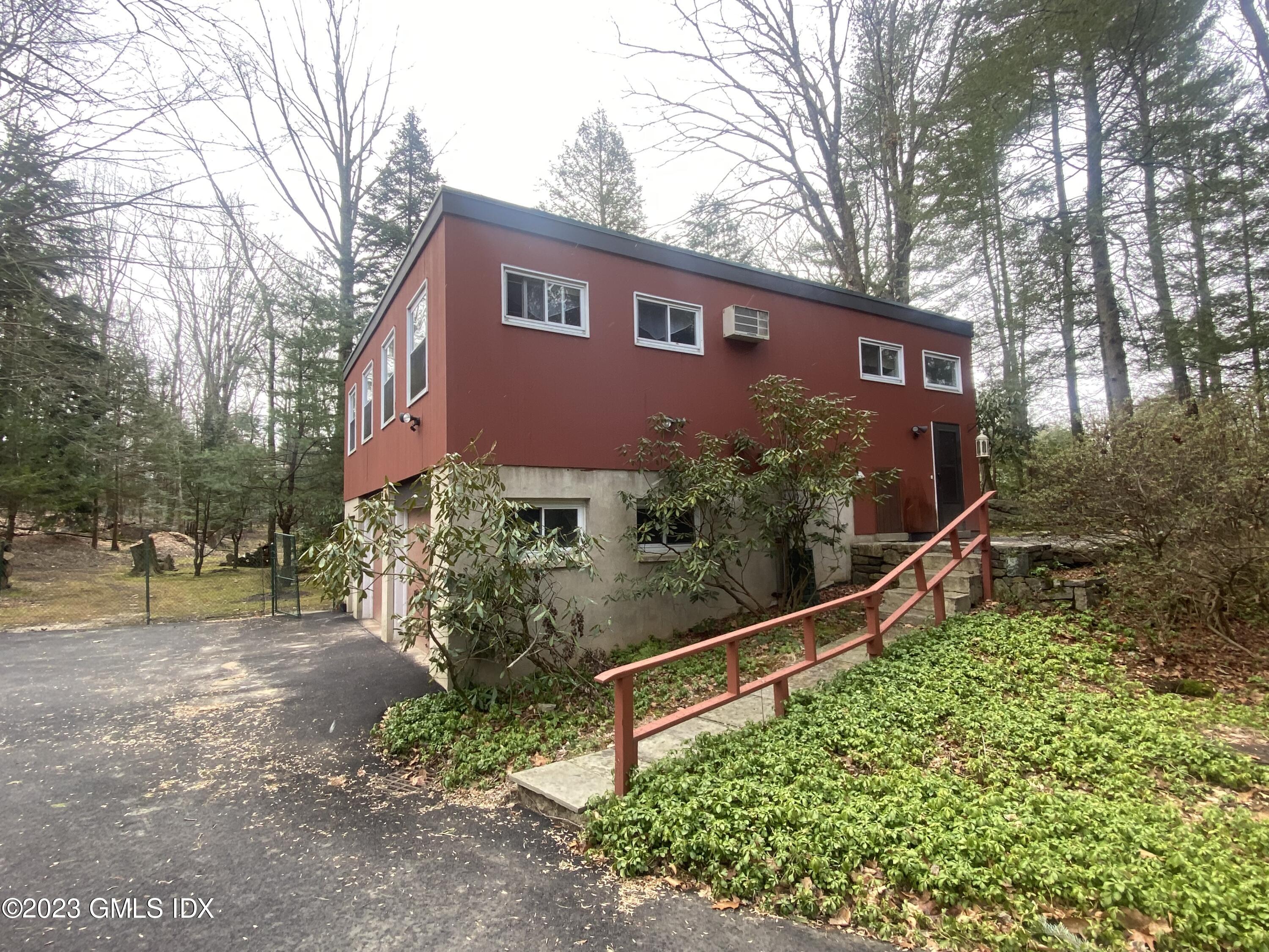 21 Hycliff Road Greenwich, CT 06831 - Photo 2 of 13 a view of a house with yard and plants
