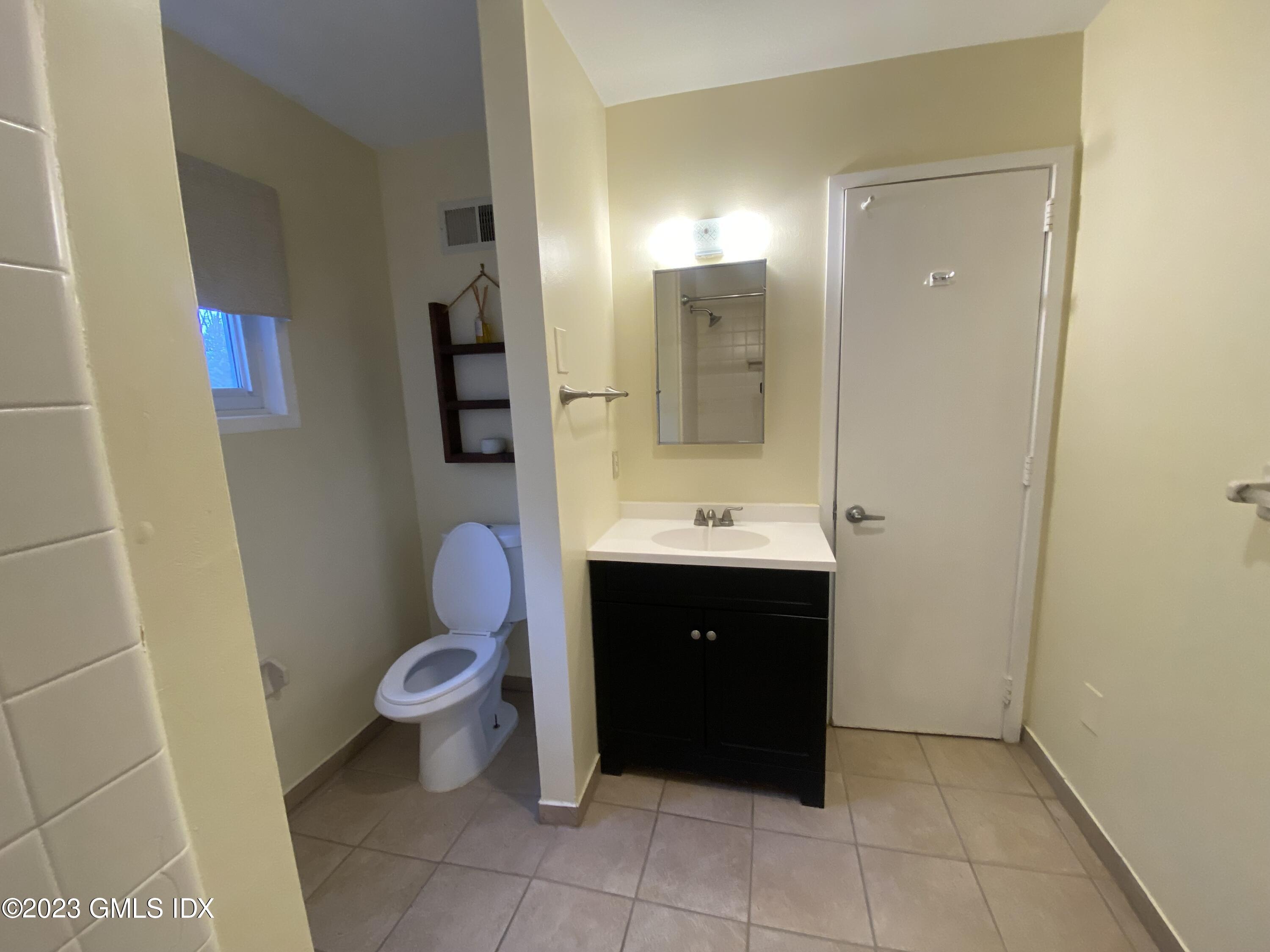 21 Hycliff Road Greenwich, CT 06831 - Photo 10 of 13 a bathroom with a sink and a mirror
