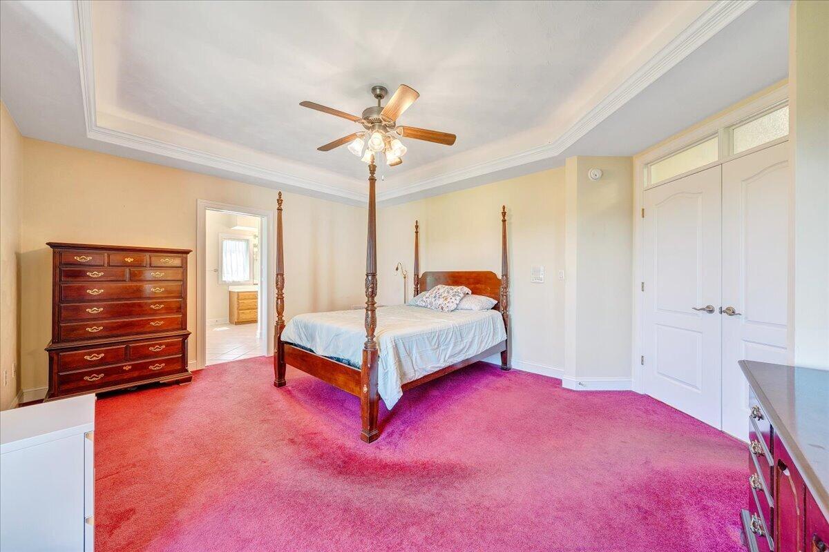 625 Frontier Way Fincastle, VA 24090 - Photo 35 of 105 a bedroom with a bed a dresser and a window