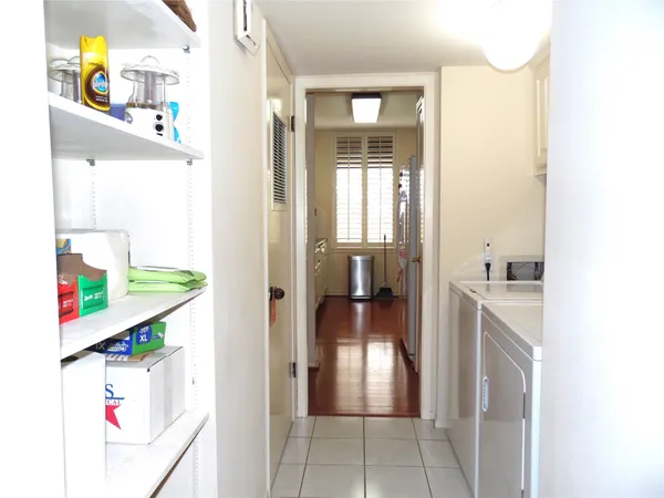 a kitchen with stainless steel appliances a refrigerator and a stove