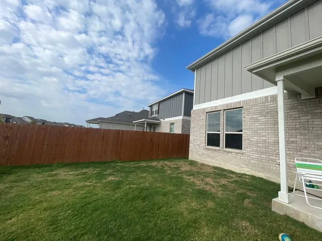a bathroom with a shower and toilet