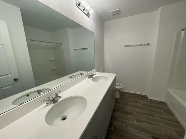 a bedroom with a bed and a chair