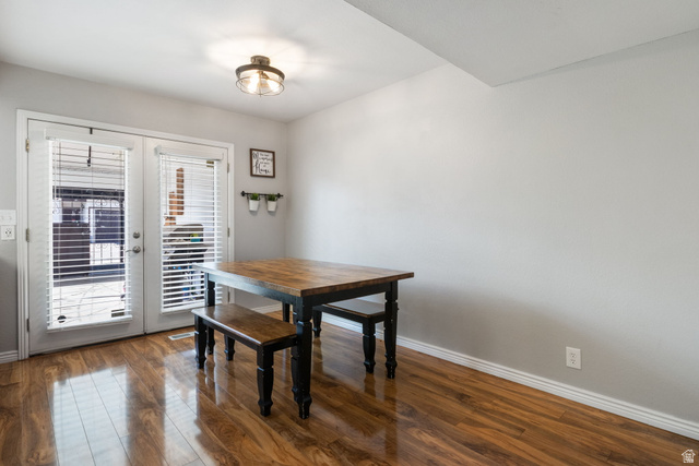 41 Benchmark Village Tooele, UT 84074 - Photo 6 of 26 Dining area with dark wood-style floors and french doors
