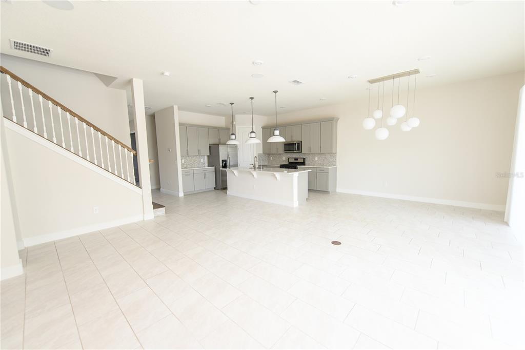 10746 Pahokee Beach Place Orlando, FL 32827 - Photo 14 of 67 a view of a livingroom with kitchen and furniture