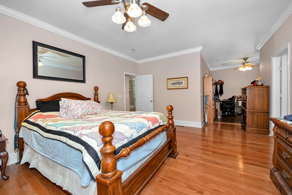 84 Scott Orchard Road Taft, TN 38488 - Photo 13 of 23 a bedroom with a bed and wooden floor