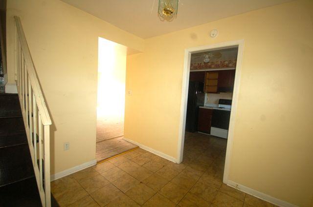 2308 Ranch Road Northwest Roanoke, VA 24017 - Photo 2 of 23 a view of a hallway with wooden floor and a bathroom