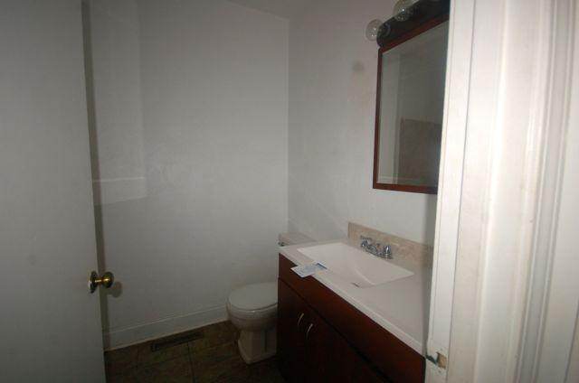 2308 Ranch Road Northwest Roanoke, VA 24017 - Photo 20 of 23 a bathroom with a sink and a toilet