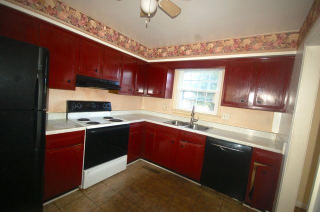 2308 Ranch Road Northwest Roanoke, VA 24017 - Photo 3 of 23 a kitchen with stainless steel appliances granite countertop a sink stove and refrigerator