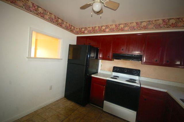 2308 Ranch Road Northwest Roanoke, VA 24017 - Photo 4 of 23 a room with a refrigerator and a window