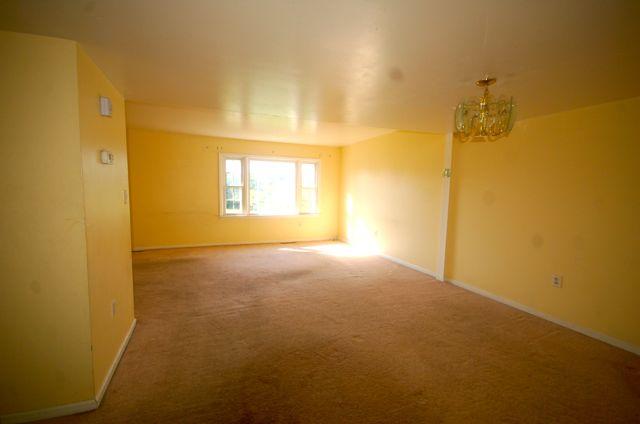 2308 Ranch Road Northwest Roanoke, VA 24017 - Photo 5 of 23 a view of a room with a empty space and a window