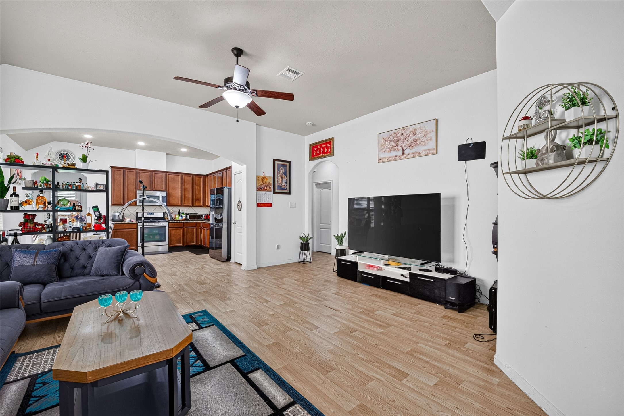 9314 Fuqua Ridge Lane Houston, TX 77075 - Photo 4 of 24 a living room with furniture and a flat screen tv