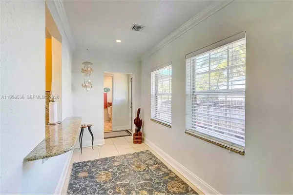 a living room with furniture and a rug
