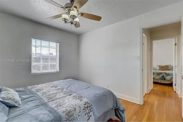 a bedroom with a bed and a view of bedroom