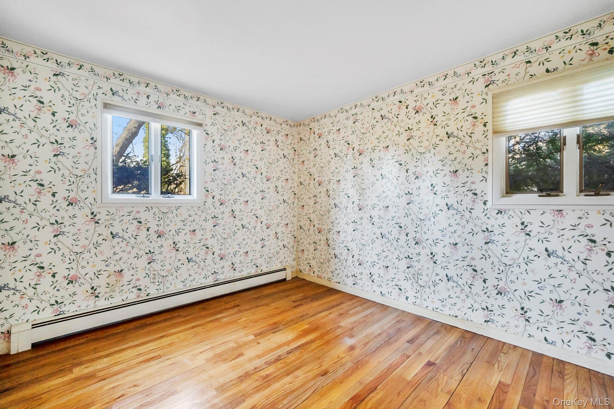 149 Munsell Road East Patchogue, NY 11772 - Photo 11 of 29 a view of a room with wooden floor and a window