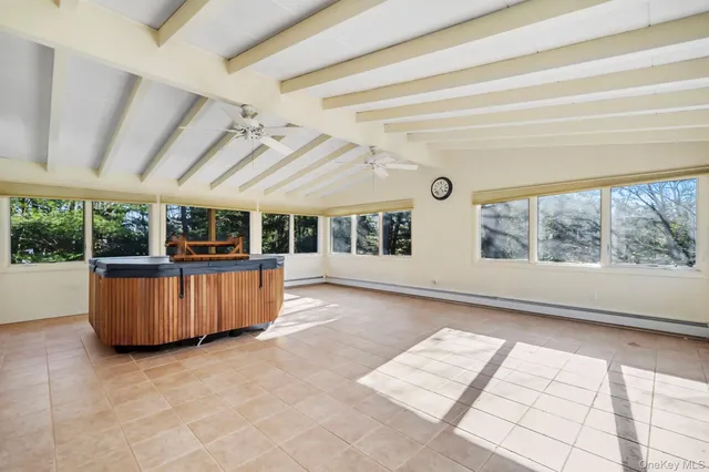 a bathroom with a granite countertop sink mirror and a shower