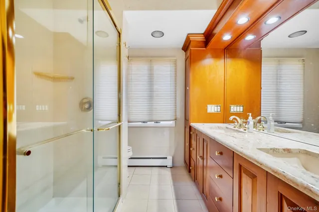 wooden floor with a bed and a window